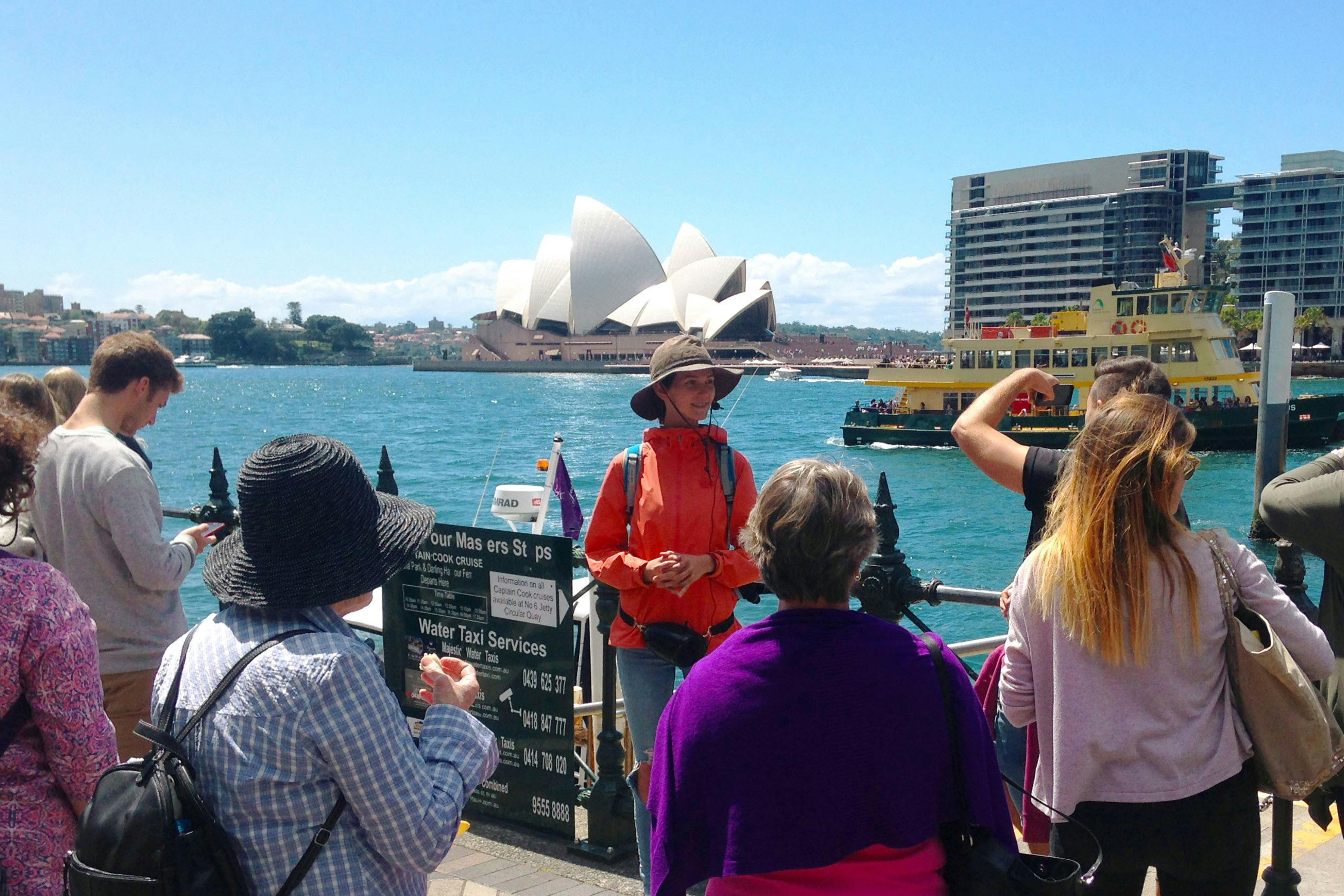 Free local tour Sydney group is enjoying the views of Sydney Harbour and the Sydney Opera House.