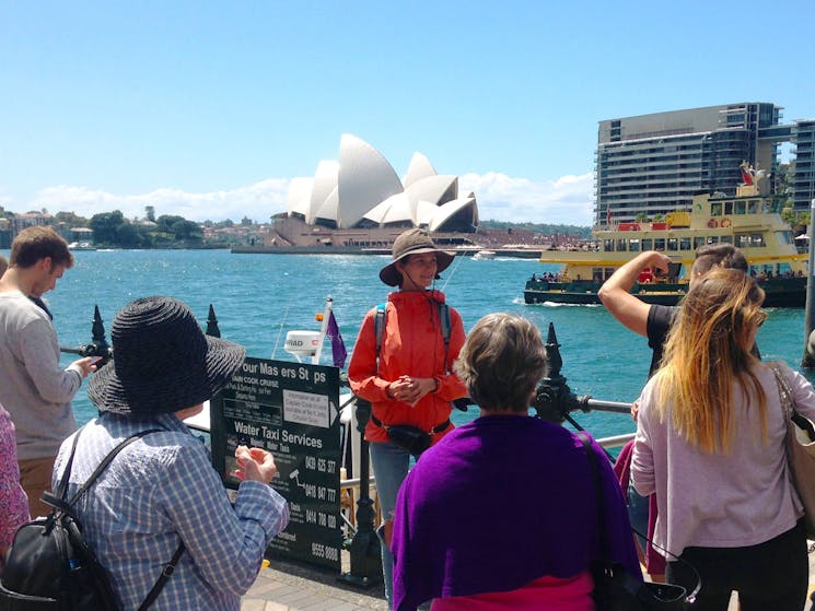 Free local tour Sydney group is enjoying the views of Sydney Harbour and the Sydney Opera House.