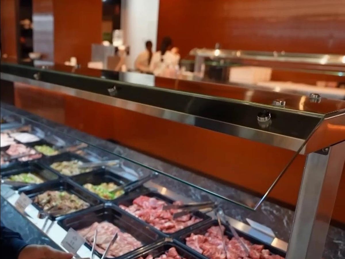 Selection of fresh sliced meats and marinated BBQ cuts at the buffet station Selection of fresh sliced meats and marinated BBQ cuts at the buffet station