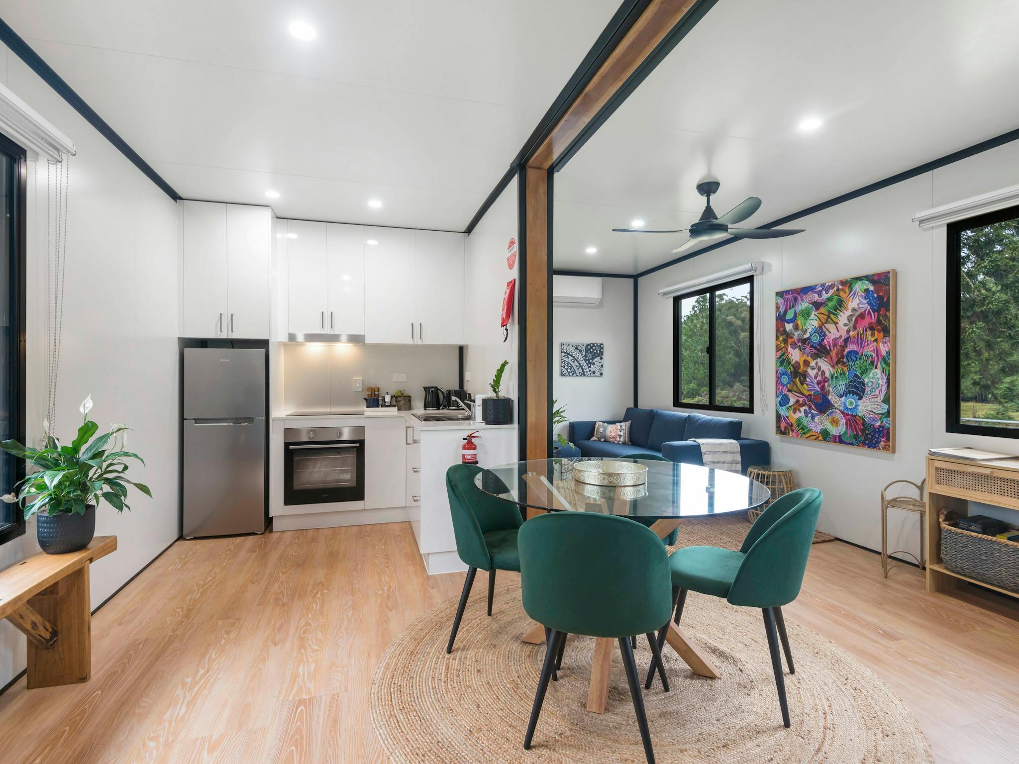 4 person dining table, comfortable lounge and a fully equipped kitchen image