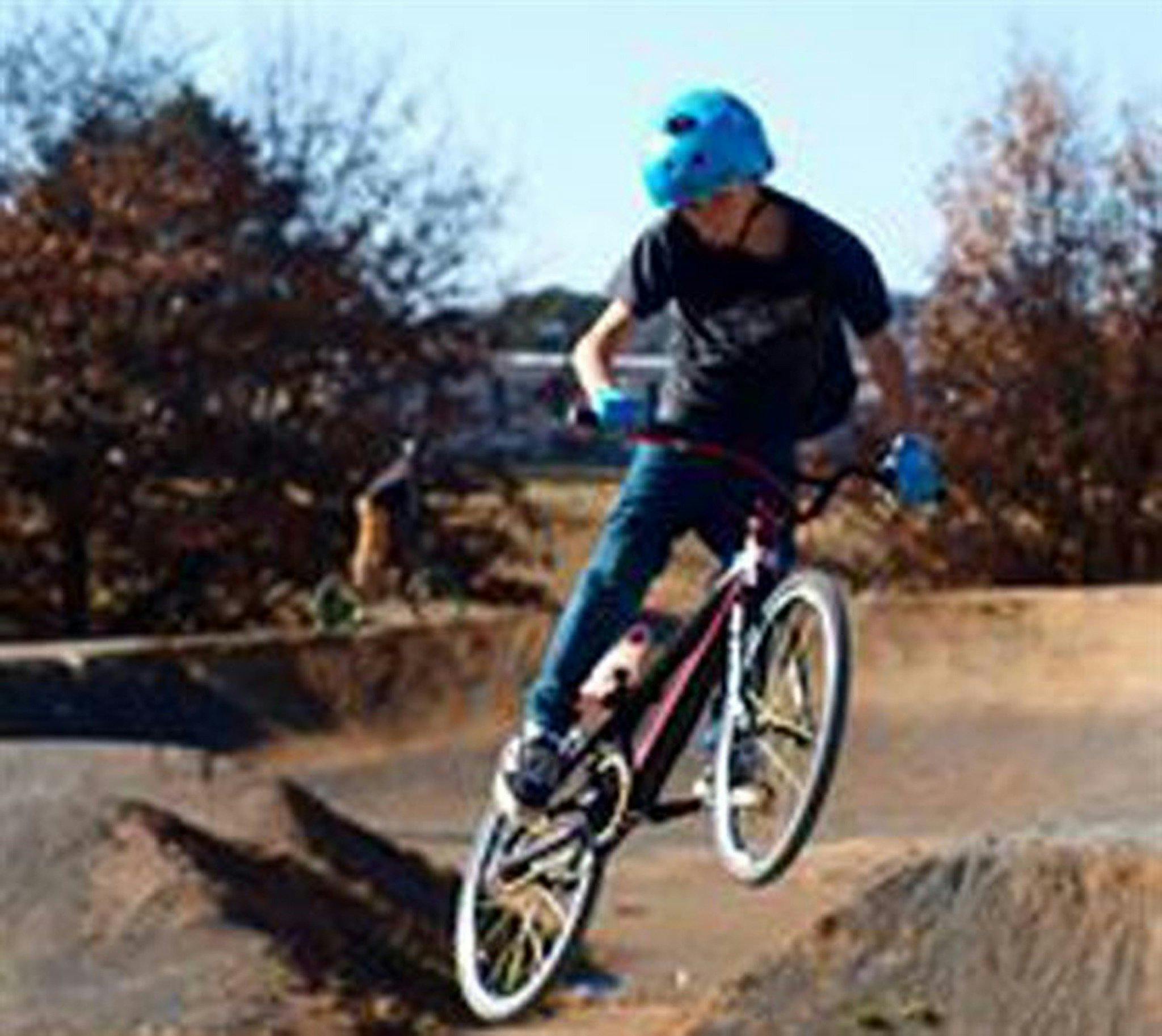 Teenager on BMX riding the track