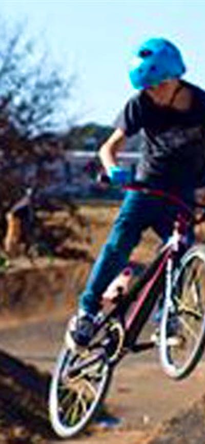 Teenager on BMX riding the track