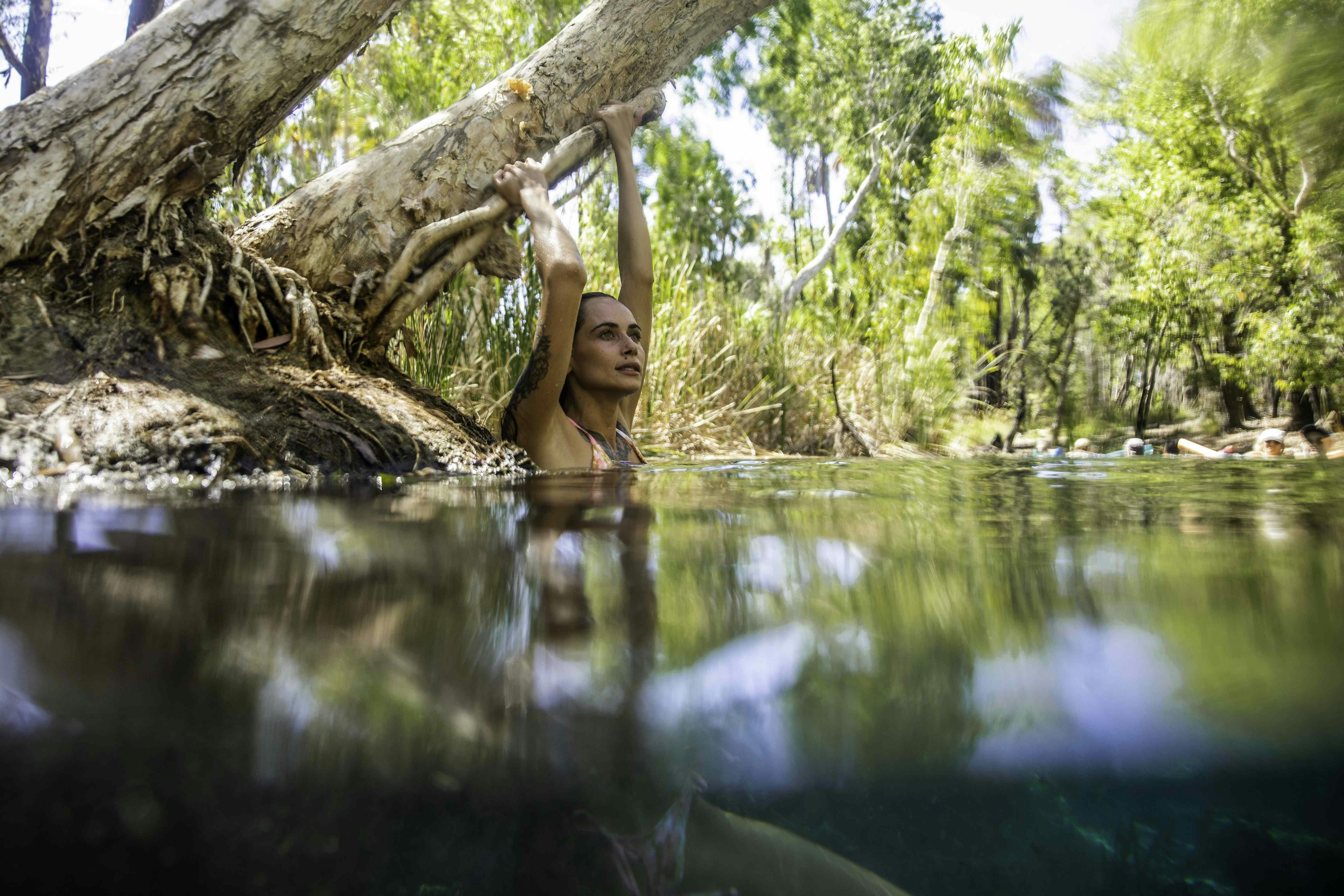 Woman swimming in Bitter Springs