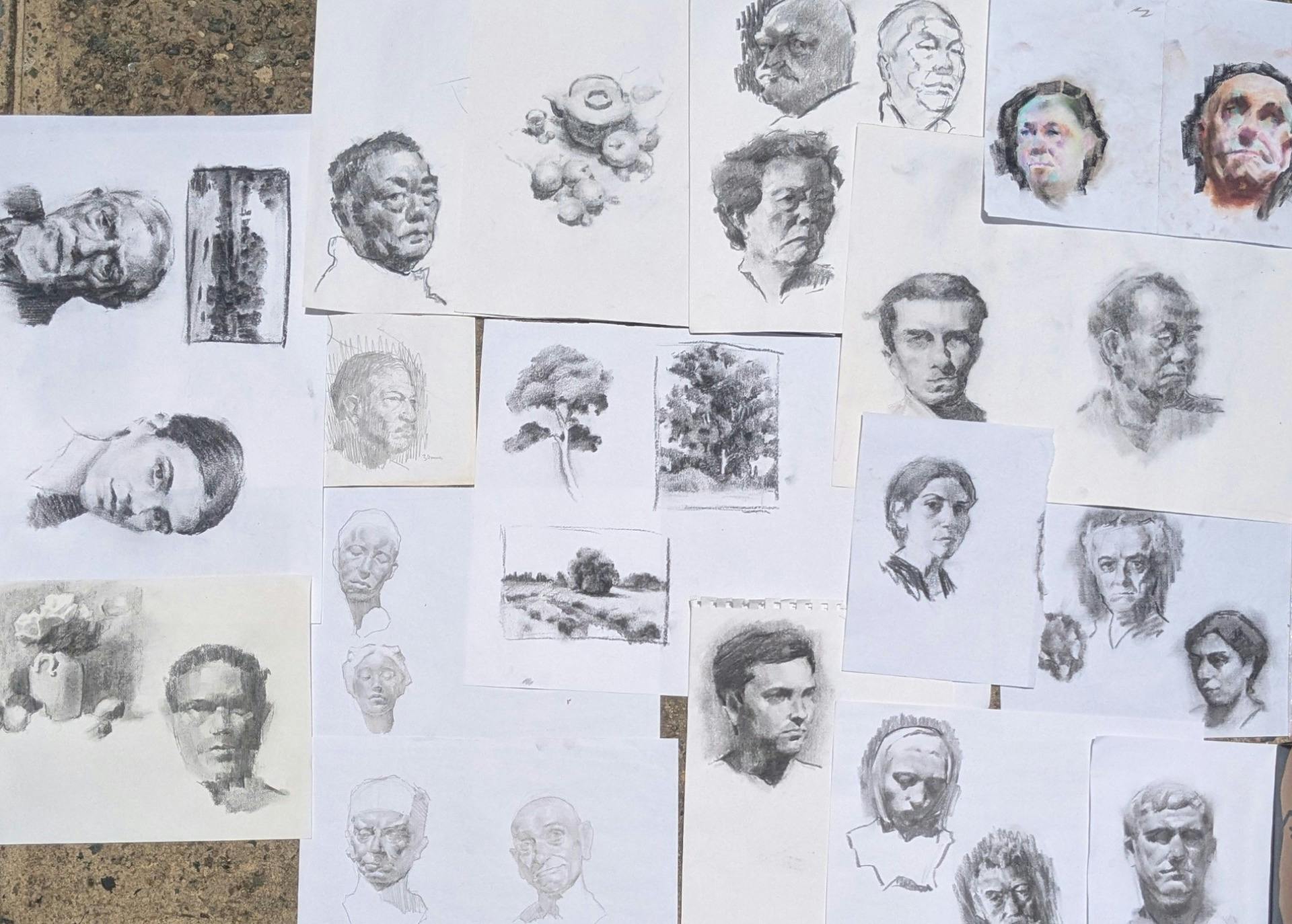 A collage of charcoal and graphite drawings by Paul. Comprised of faces, trees and still life images