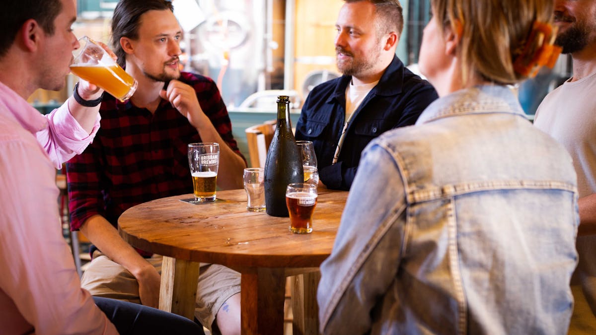 Customers chatting over a beer