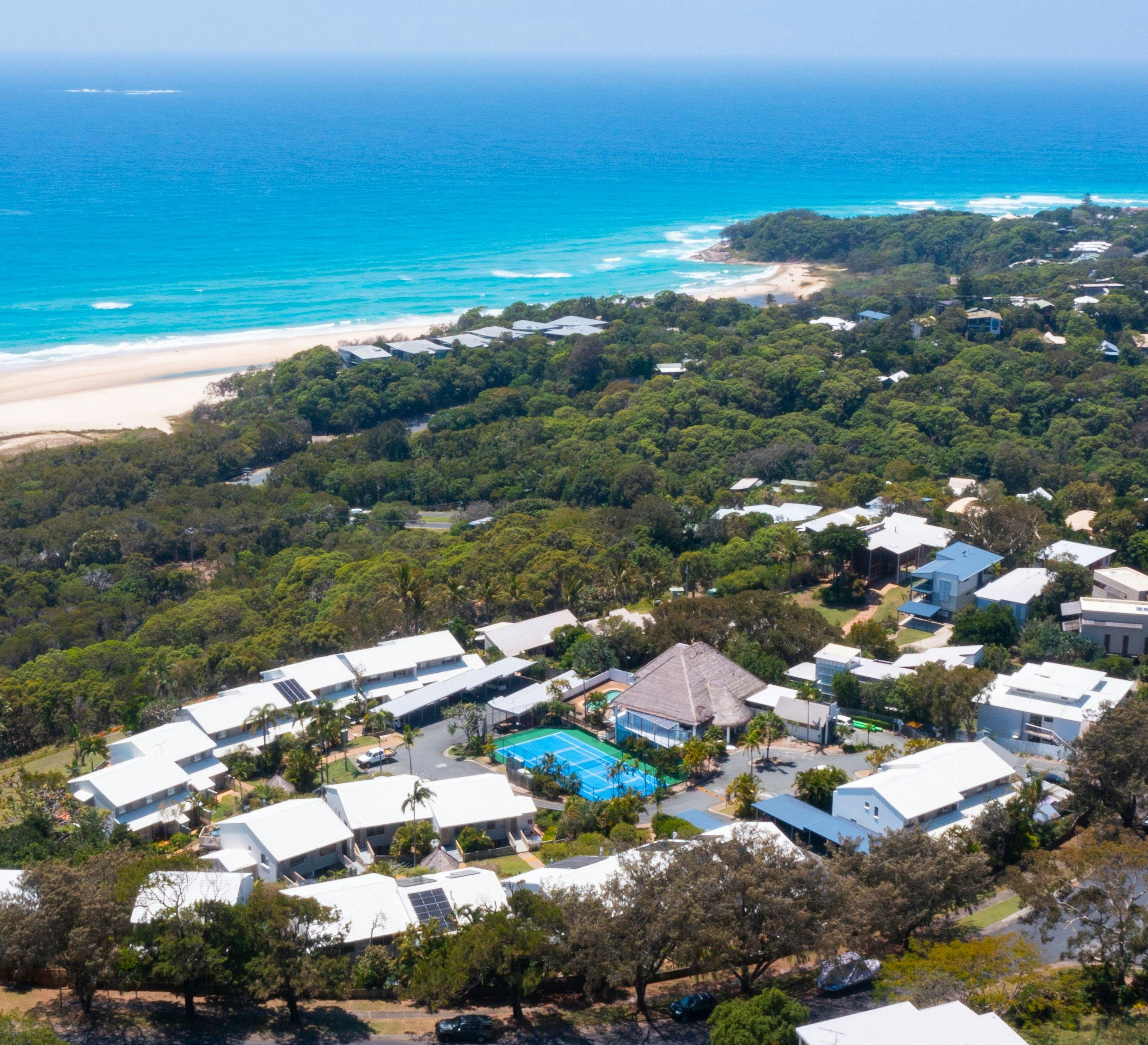 Aerial view looking over Cylinder Beach and the Coral Sea