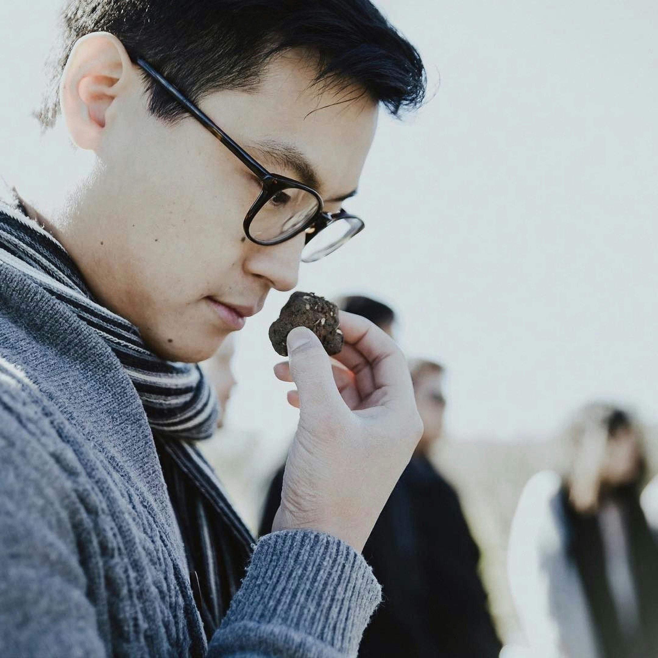 Asian man smelling truffle