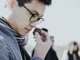 Asian man smelling truffle