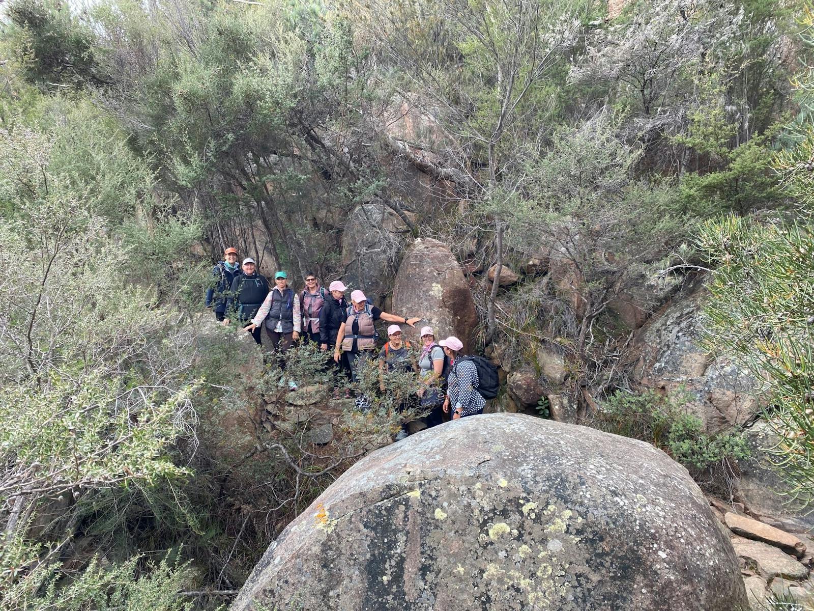 Group of women on rocky trail hiking