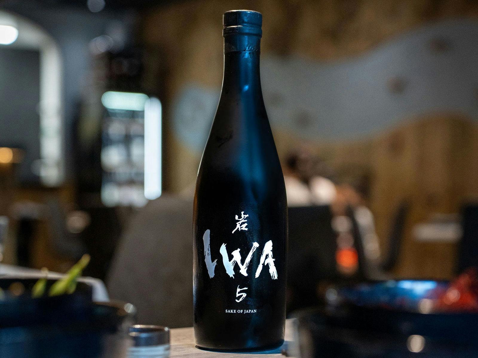 a bottle of IWA 5 sake at KOI Bar & Restaurant.