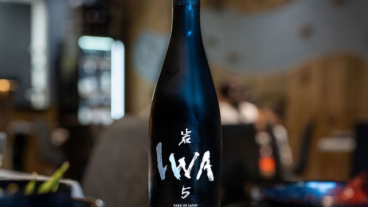 a bottle of IWA 5 sake at KOI Bar & Restaurant.