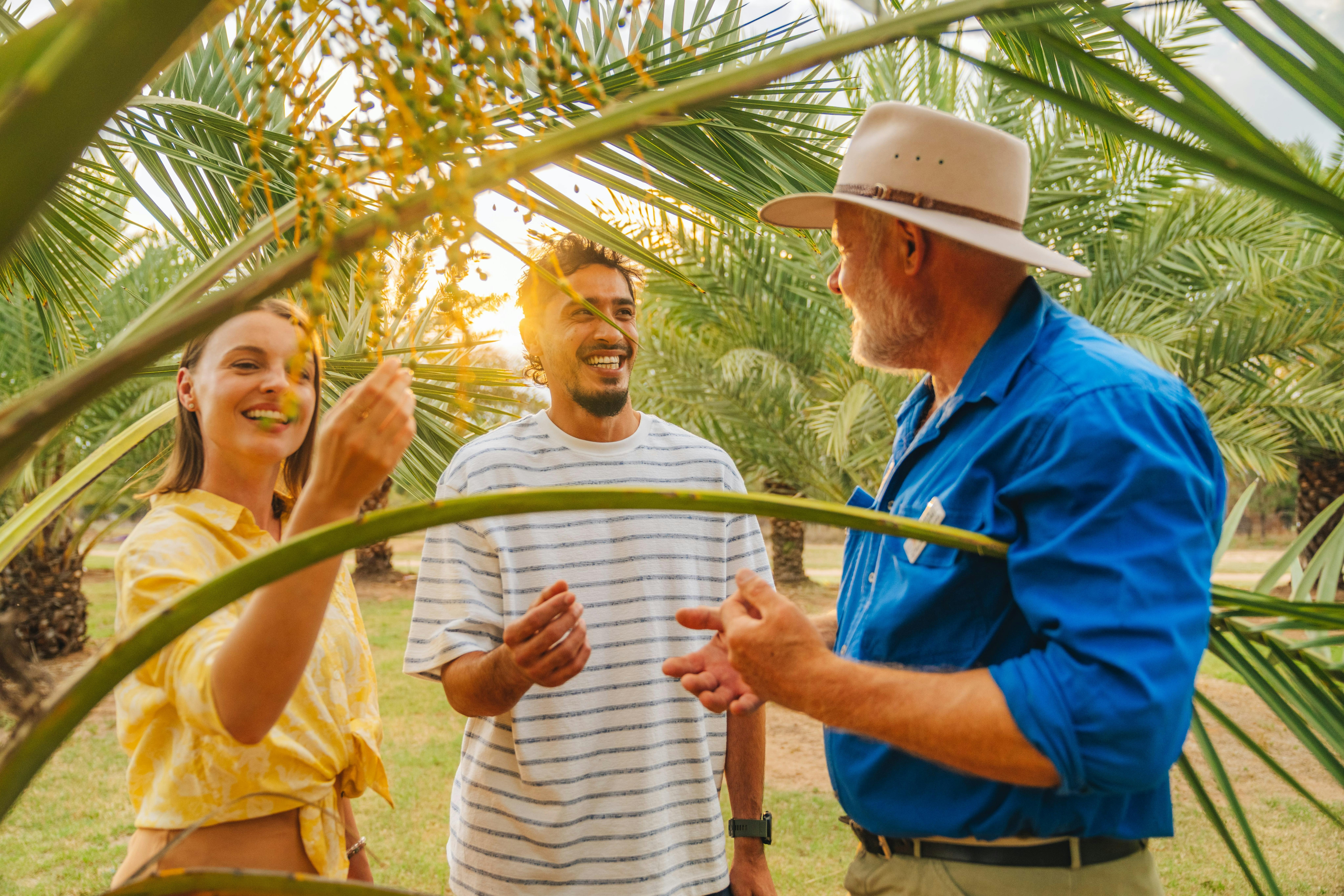 Date farmer entertaining tourists
