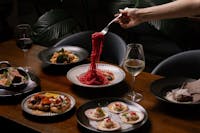 Table full of food with pasta