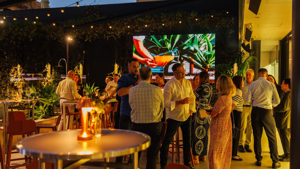 Group of people enjoining an evening event at Hibiscus Bar & Terrace