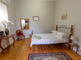 Queen bed airconditioned with adjoining lounge.