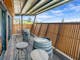 Upstairs balcony with local wine barrels and stools with a view over picturesque Beechworth