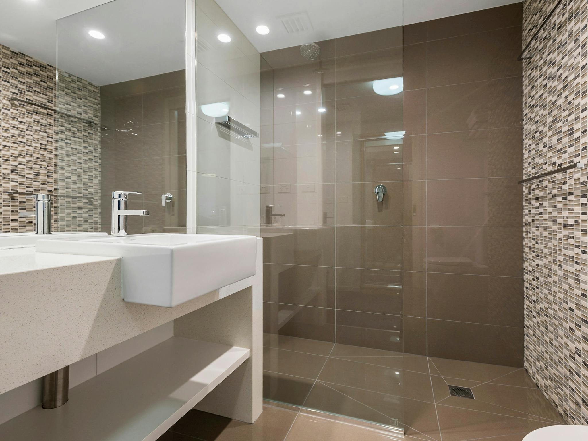 The Gateways Queen Suite Bathrooms feature walk in shower and modern amenities