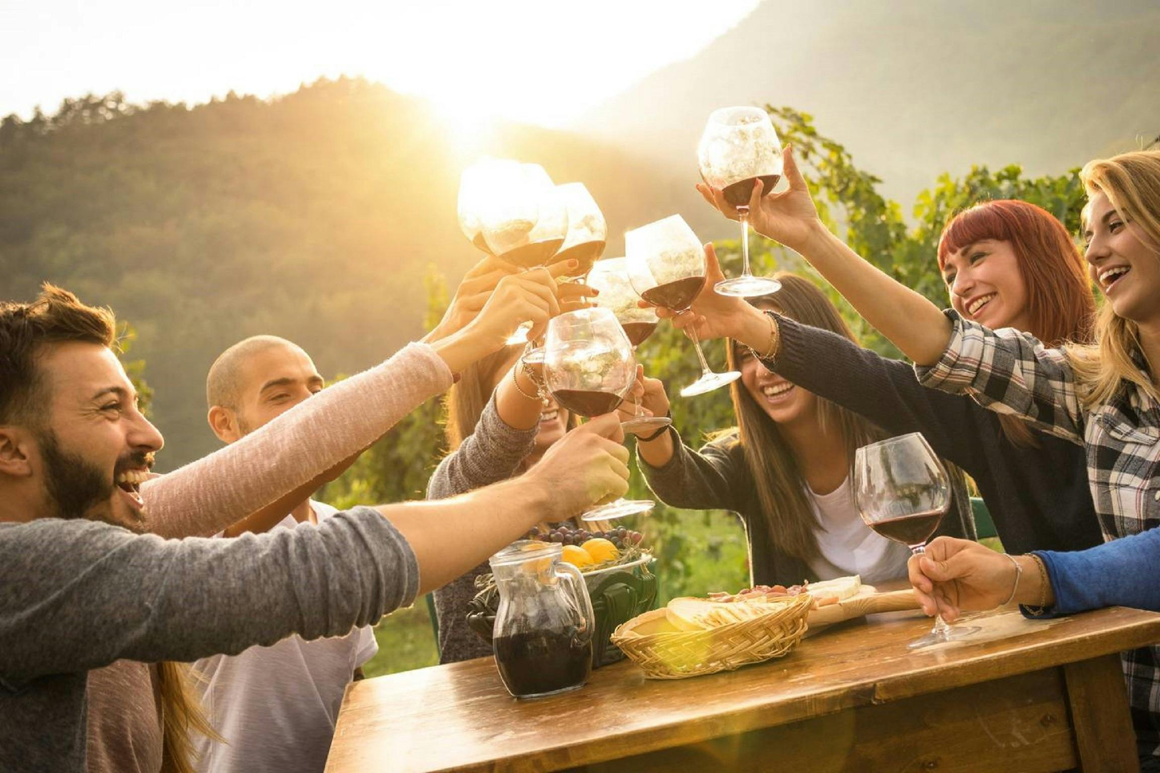 Group enjoying wine and food