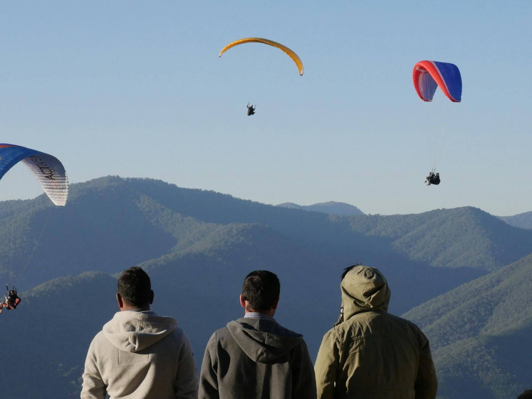 Tandem paragliders over Mystic Mountain Bright