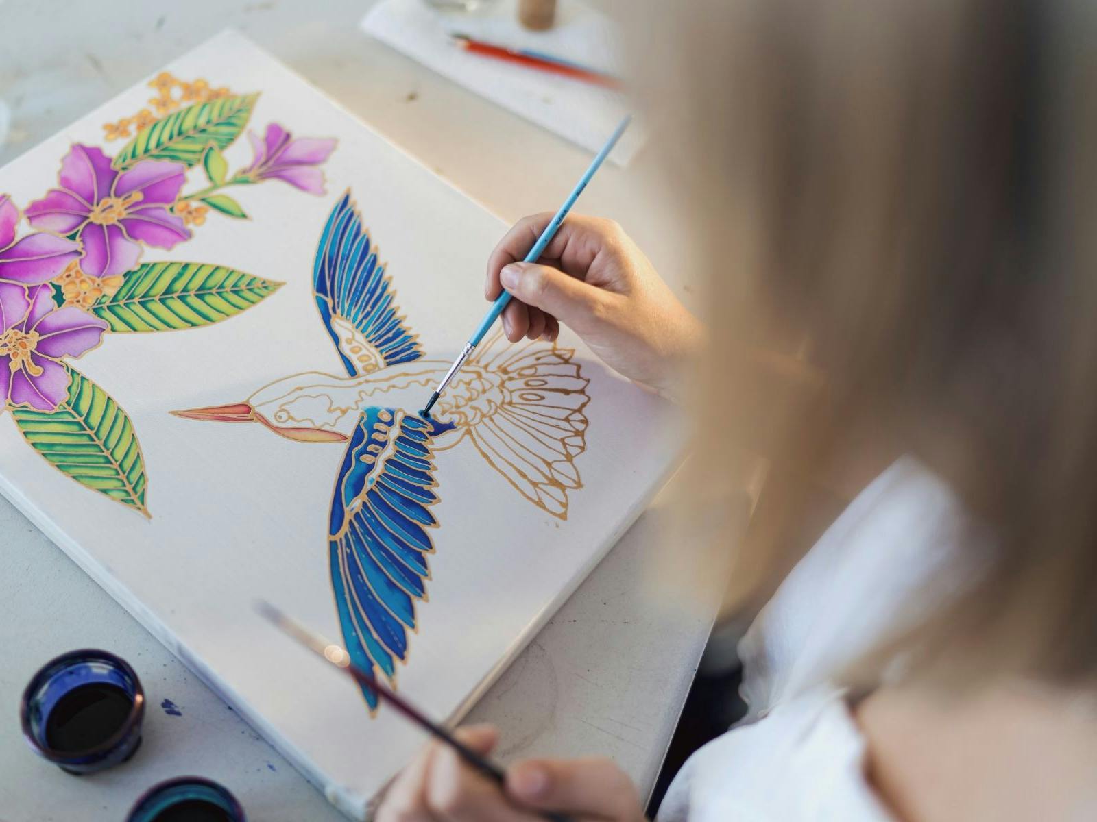 Lady painting a Kim Toft artwork