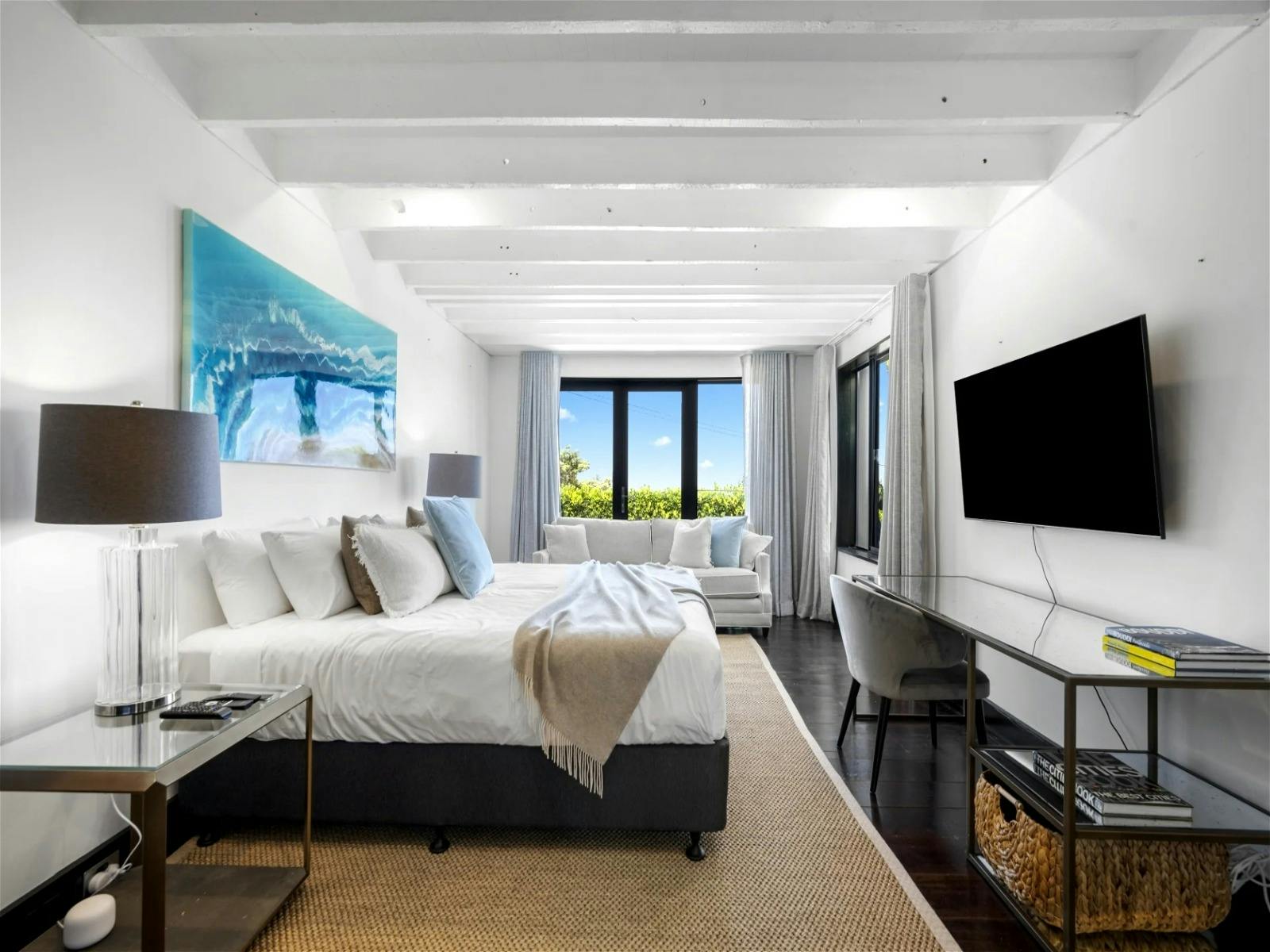 King bed with spacious ensuite featuring a luxurious clawfoot bath for indulgent relaxation