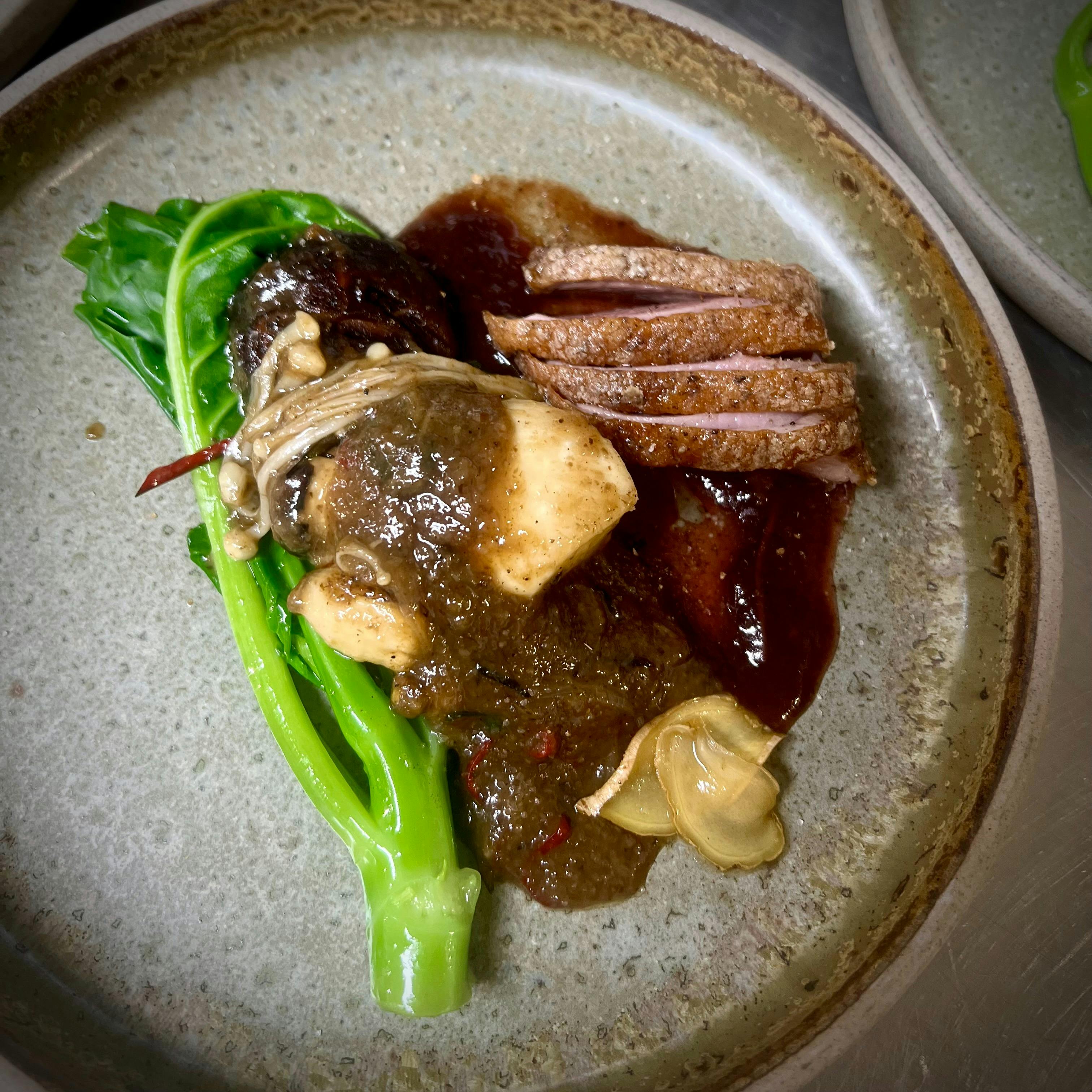 tea smoked duck with sauteed mushrooms & chi sum.