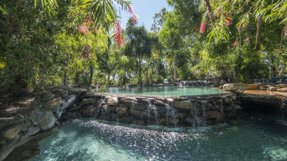 Four tiered natural rock swimming pool located near the restaurant and bar