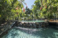 Four tiered natural rock swimming pool located near the restaurant and bar