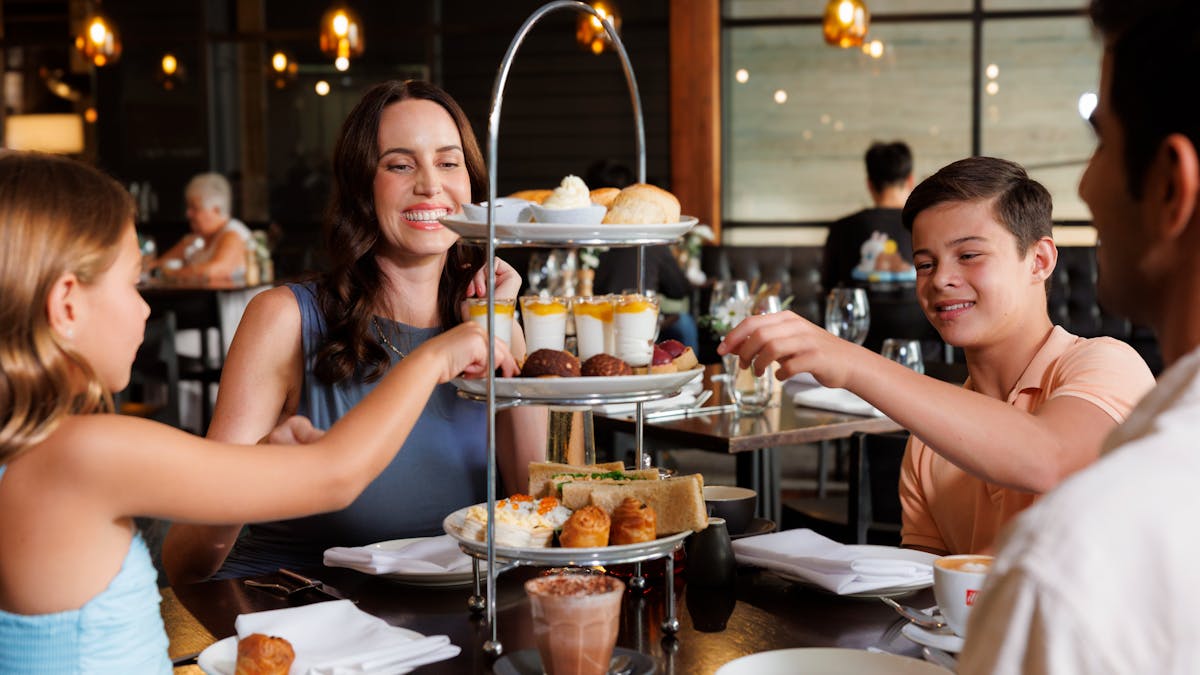 Family enjoining a High Tea at Lennons Restaurant & Bar, Brisbane City
