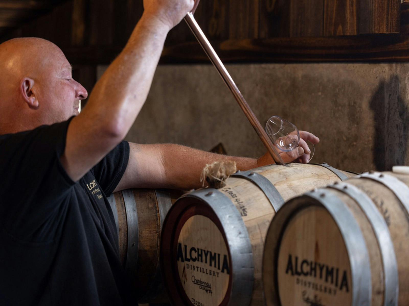 Barrels of spirits being tested by owner of Alchymia distillery