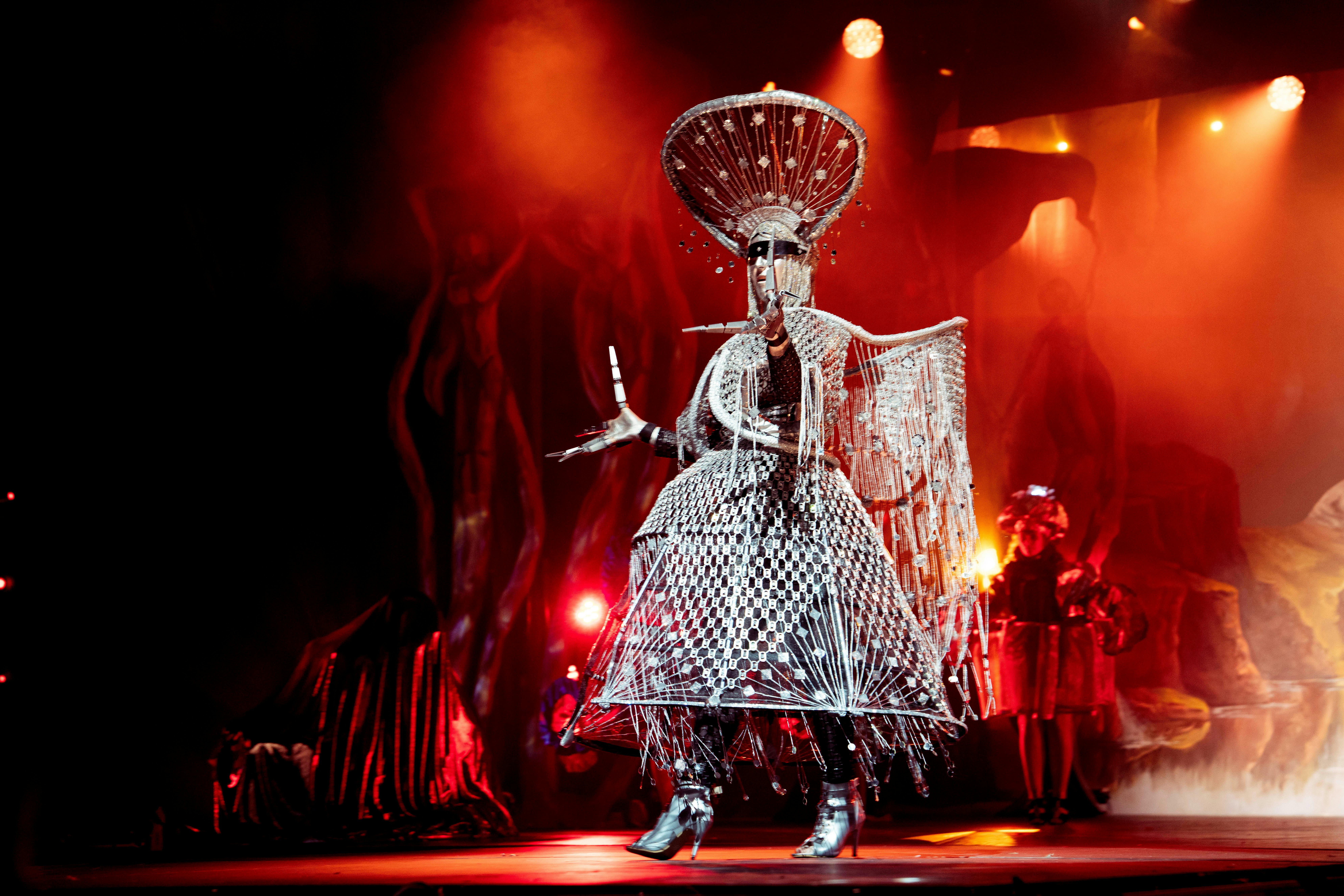 Silver wearable art piece made from can rings and adorned in shiny metalics