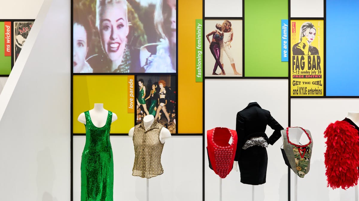 Mannequin bodices display sequined evening wear from the 1990s.