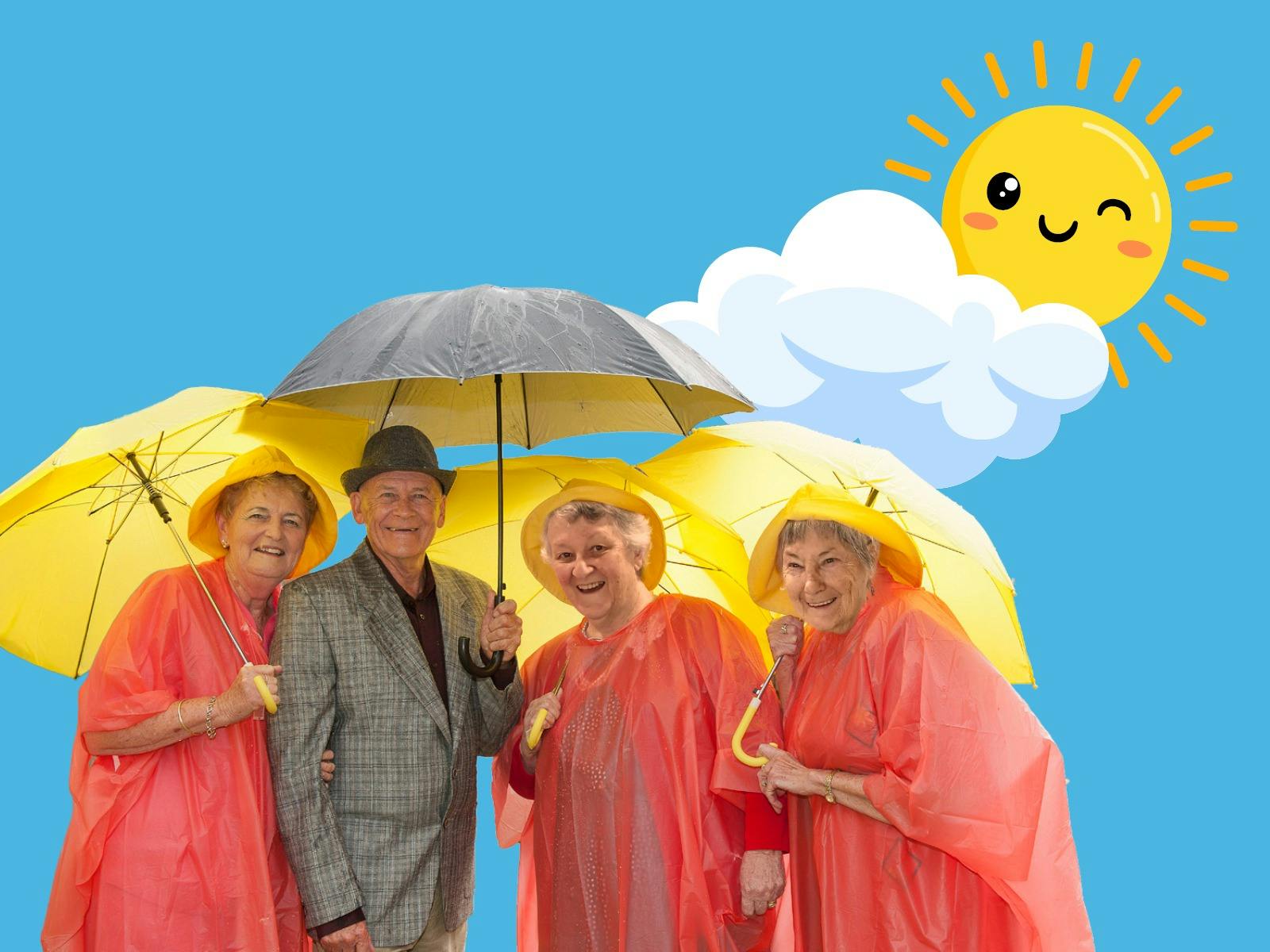 A group of older people in orange raincoats with yellow umbrellas