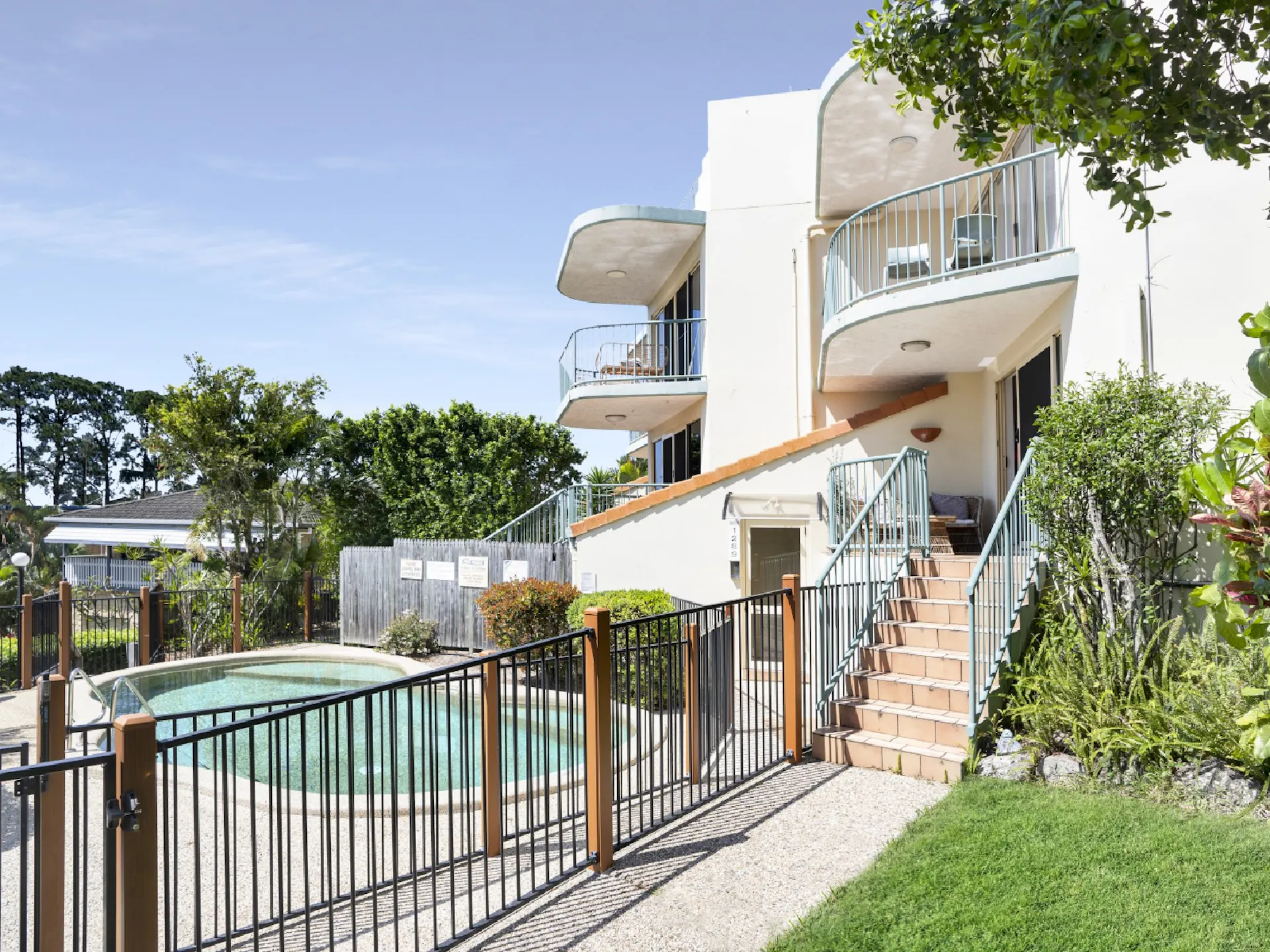 Front Garden of Highwater Haven with balcony overlooking the shared pool and views to the ocean