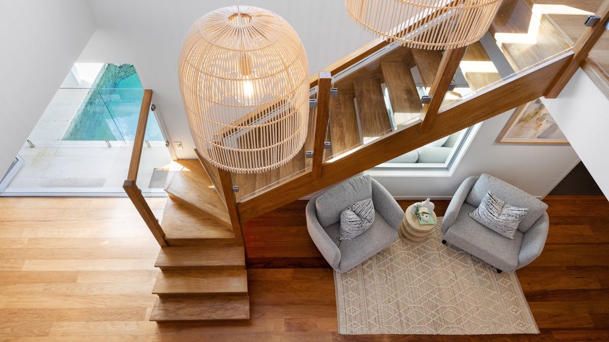 This modem and spacious beachside villa features high ceilings and timber floors.