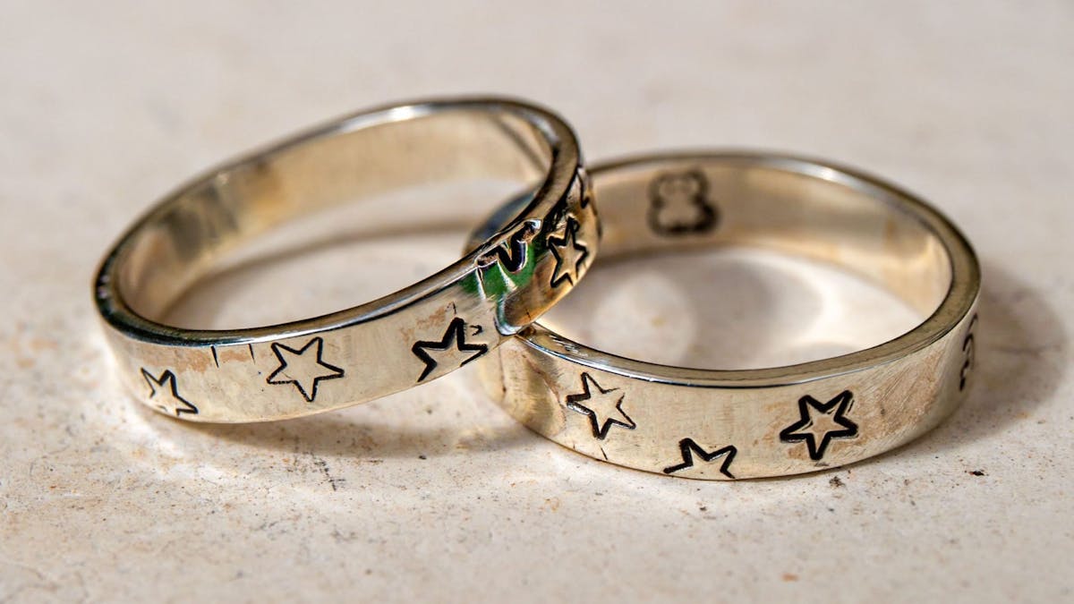 A silver ring adorned with star stamps, showcasing the ability to customise designs in our ring-maki