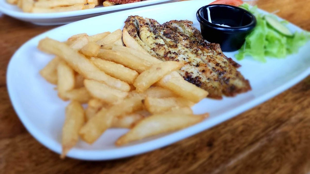 Daintree Siesta Restaurant - barramundi and chicken schnitzel main meals served with salad and chips