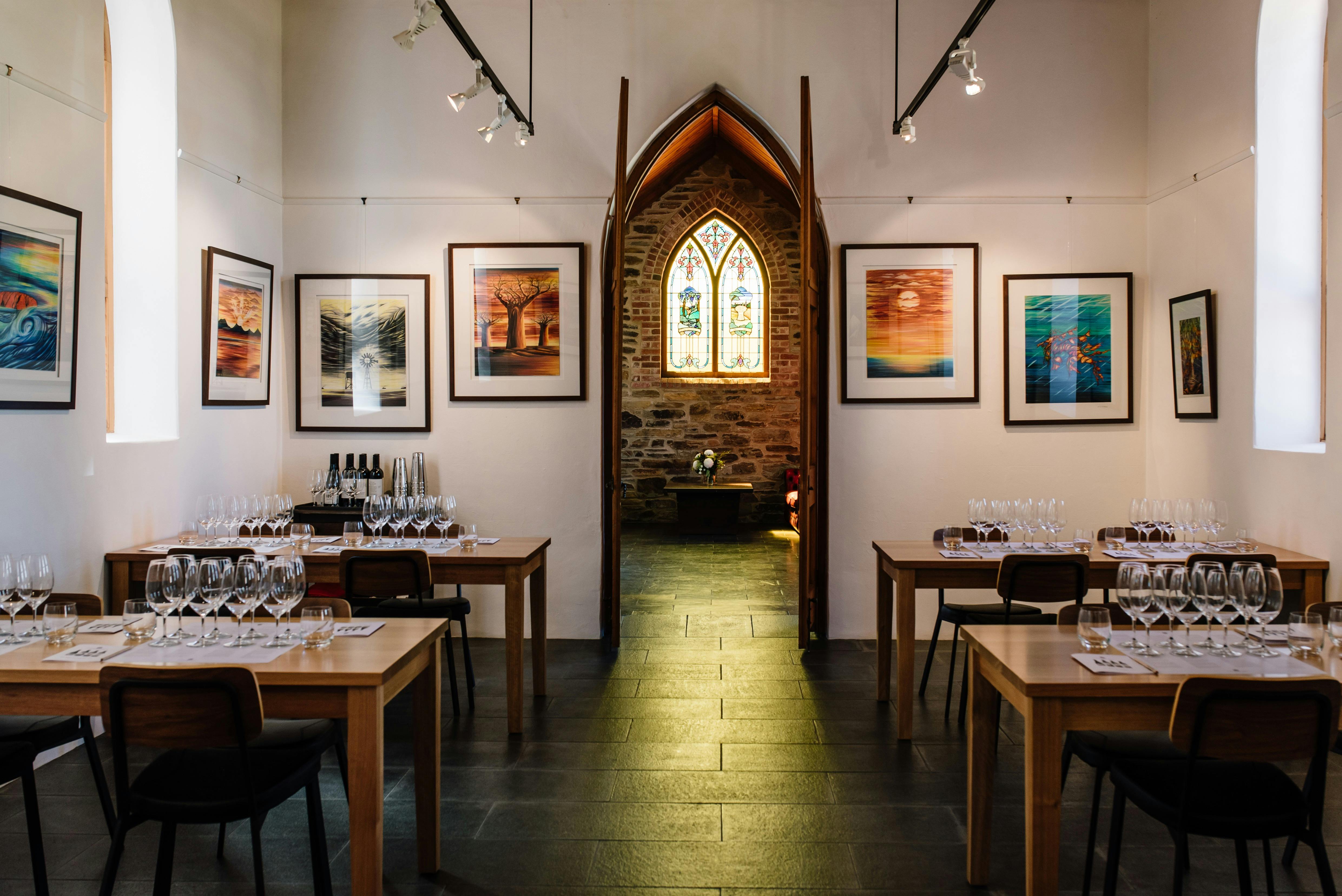 The seated tasting room at Chapel Hill, looking through to the iconic stained glass window