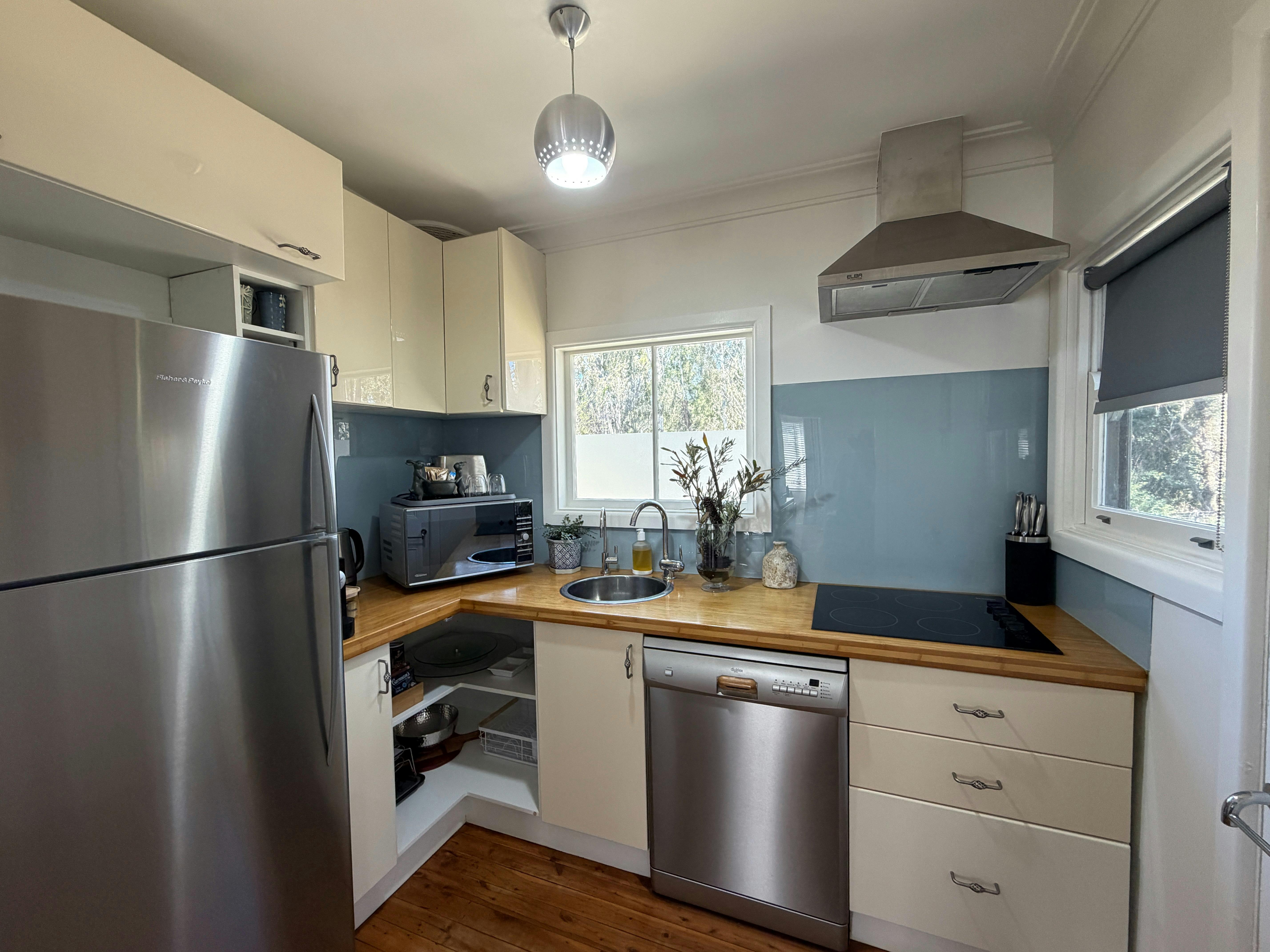 Kitchen with fridge/oven/dishwasher/ coffee machine & cooking utensils