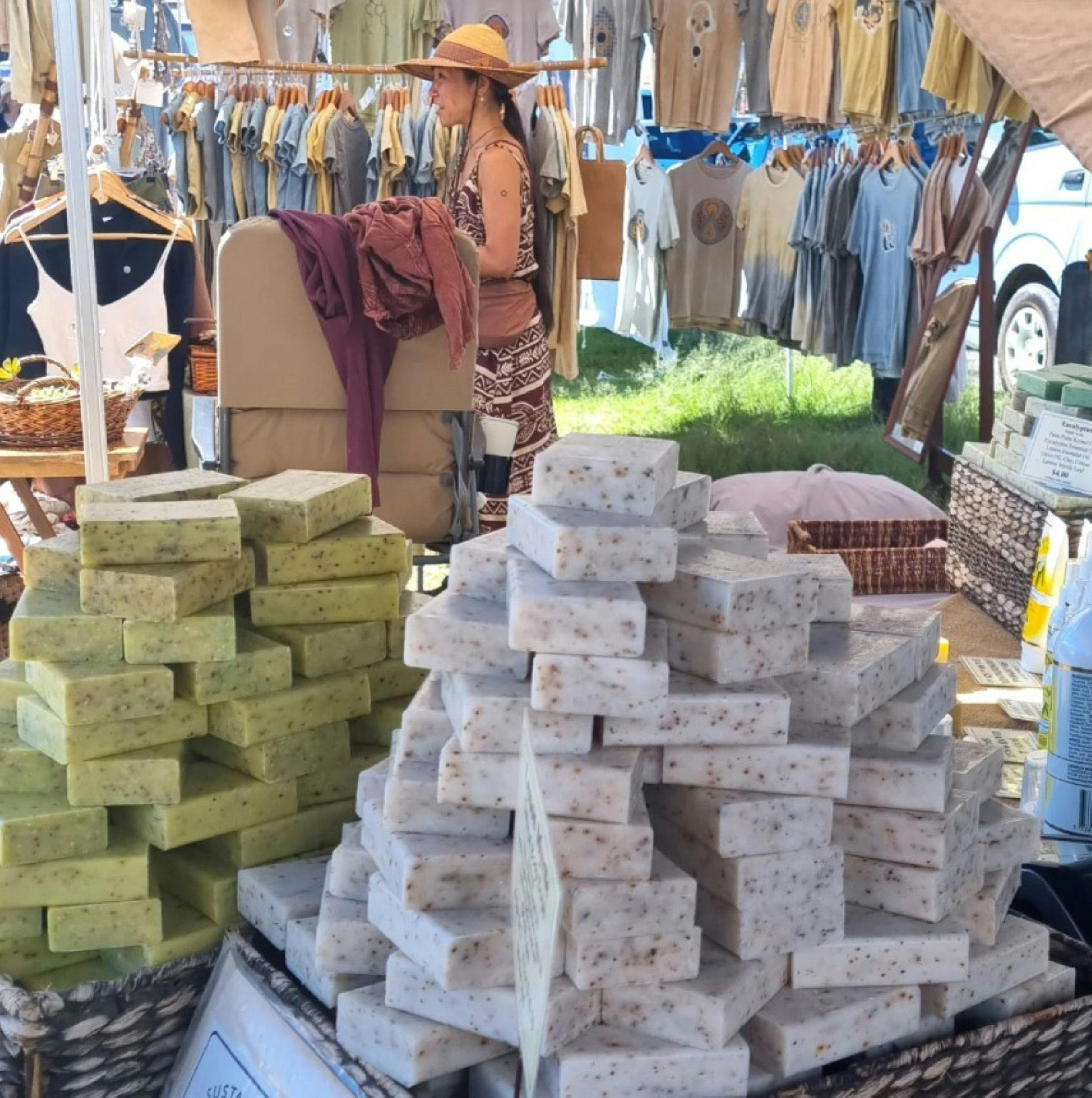 Soaps for sale as well as clothing in the background
