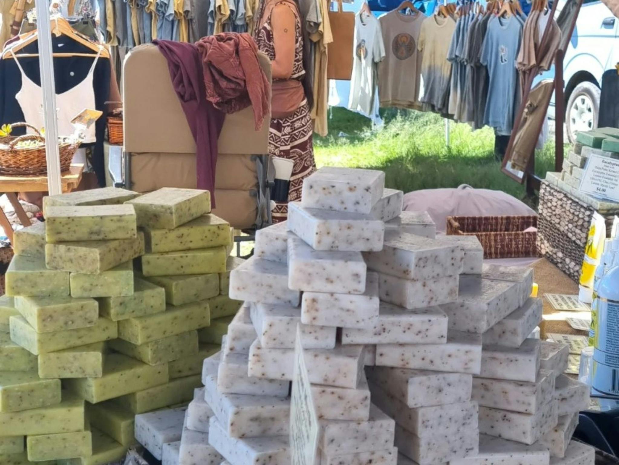 Soaps for sale as well as clothing in the background