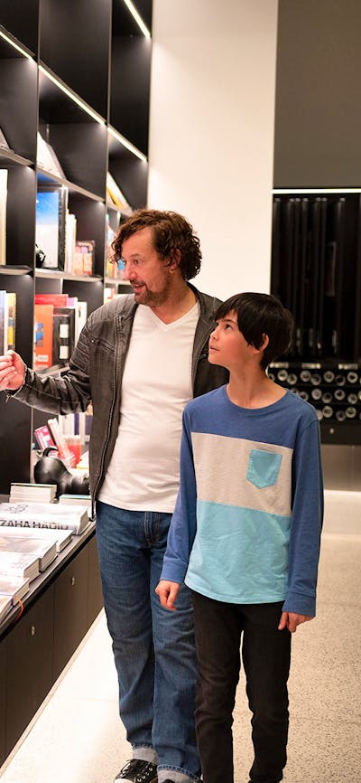 A father and son browsing books in the National Gallery Art Store