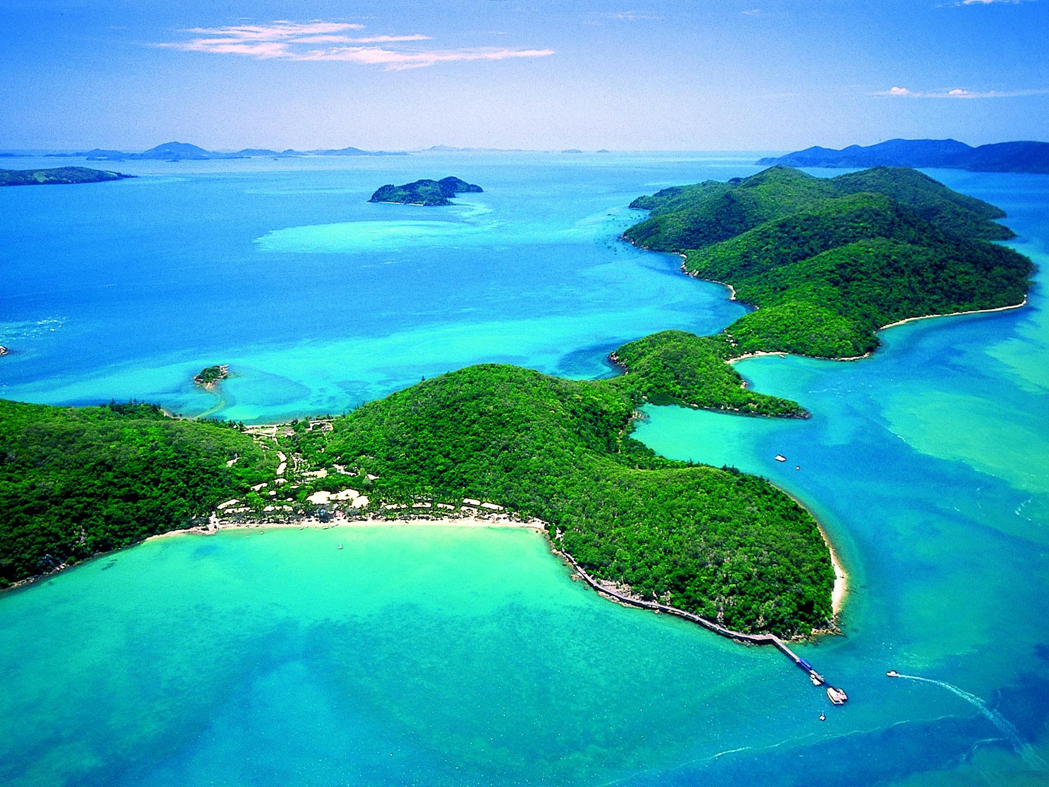Aerial view of the lenghty strech of Long Island surrounded by coral reef and calm waters Aerial view of the lenghty strech of Long Island surrounded by coral reef and calm waters