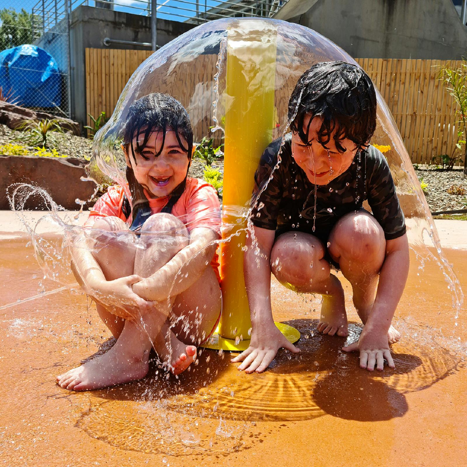 Two children enjoying themselves at the Benalla Splash Park