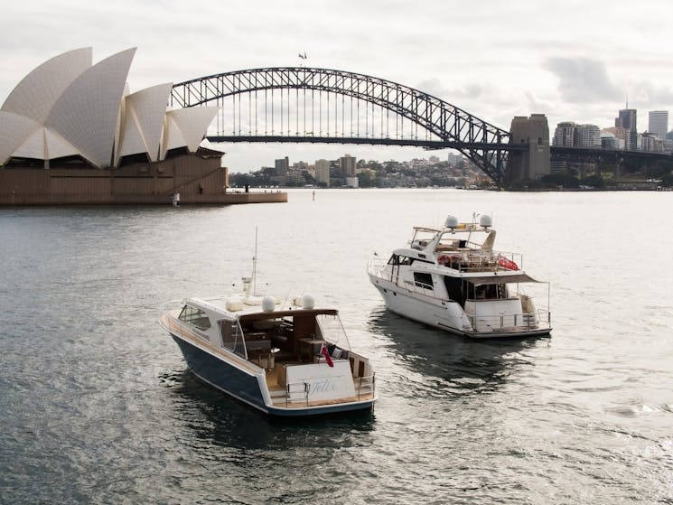 Lifestyle Charter's Felix and Enigma cruise towards the Sydney Opera House and Sydney Harbour Bridge
