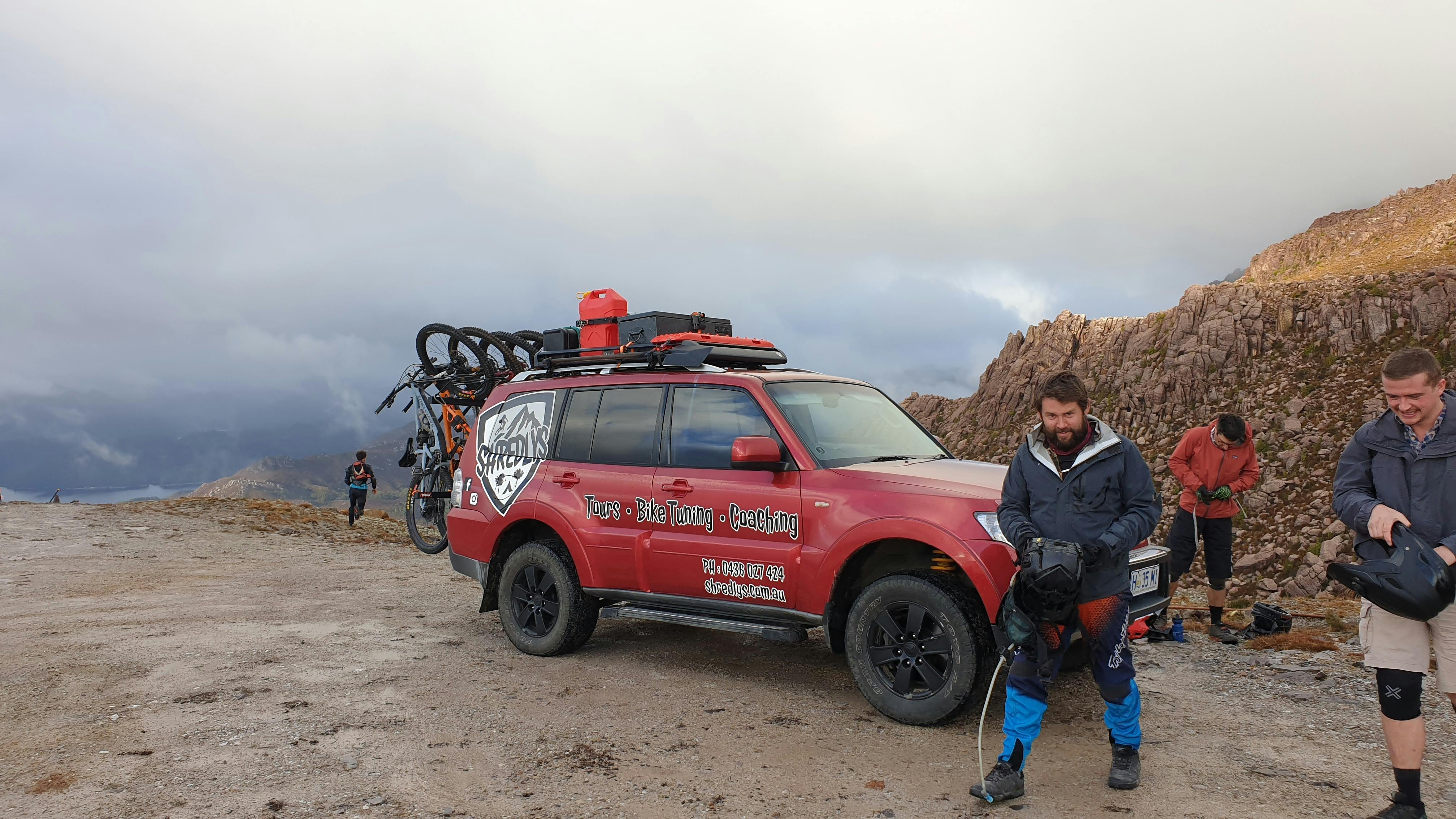 riders atop Mt Owen 4x4 shuttle tour