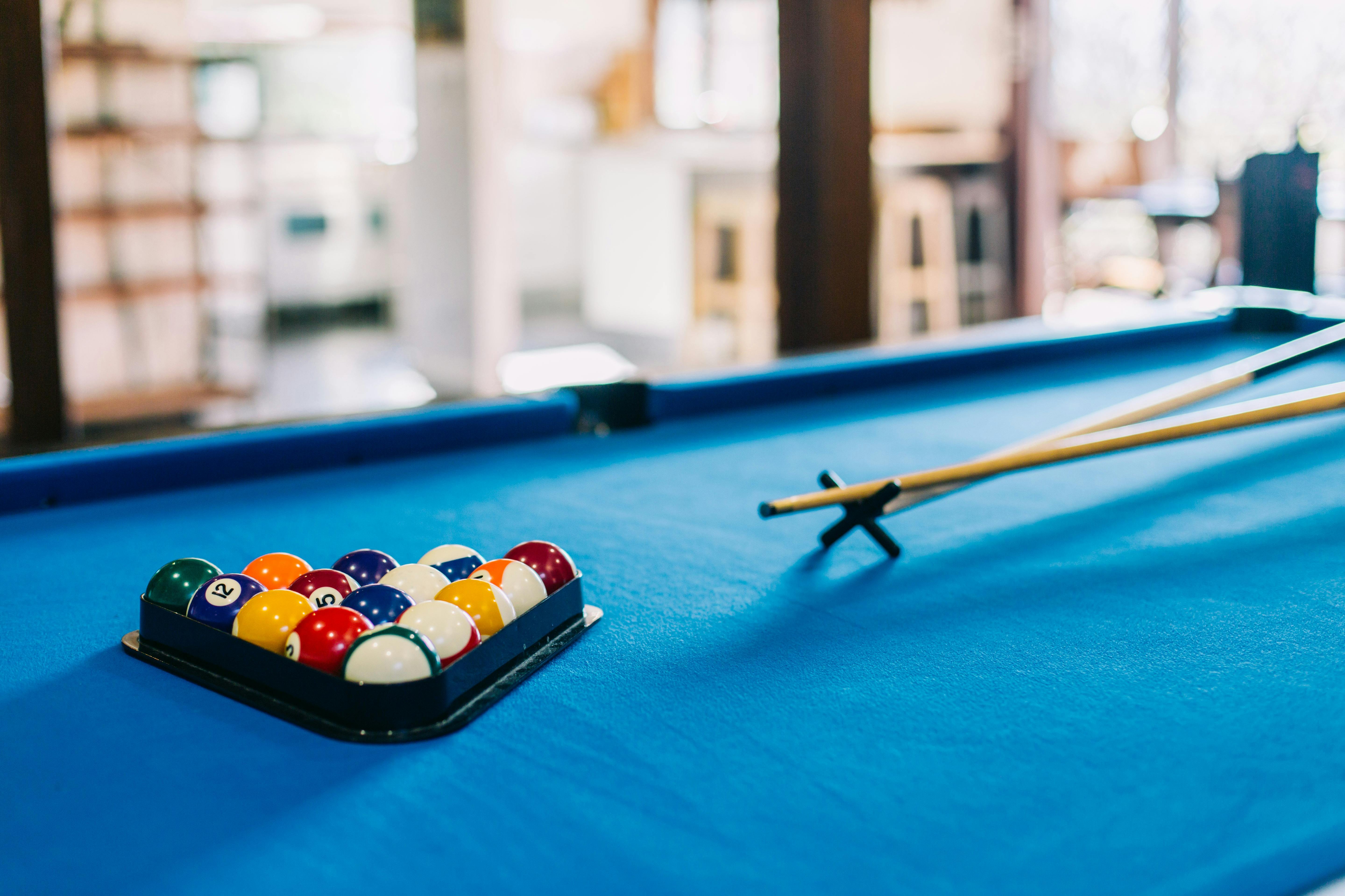 Pool table with balls and cues at Bellingen Converted Church