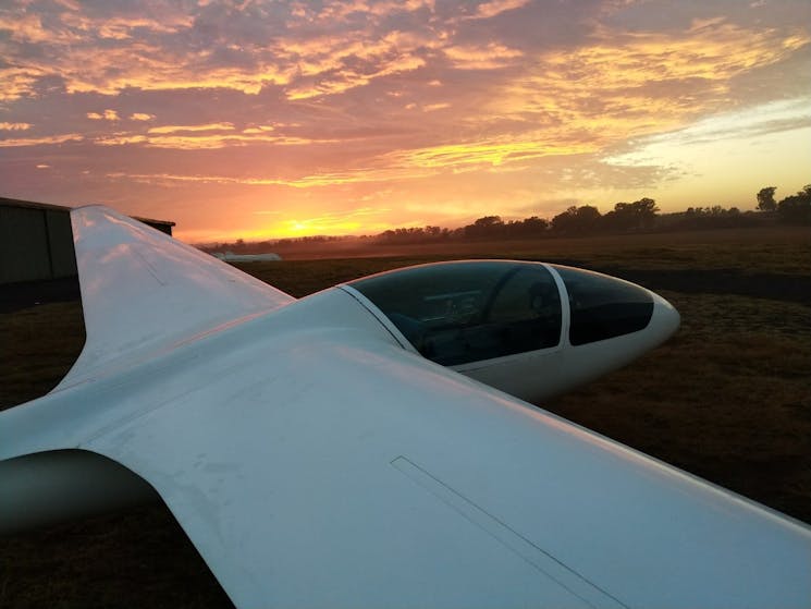 Glider plane and sunset