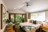 Daintree Ecolodge Canopy Treehouse interior with king bed and private balcony
