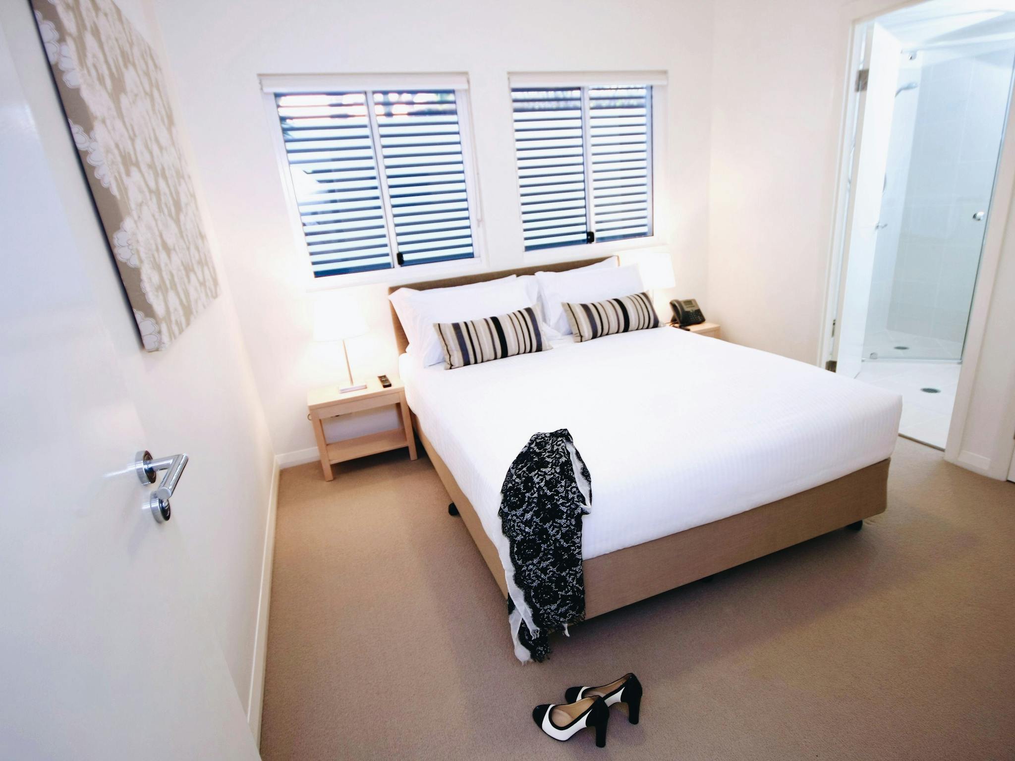 Spacious queen bedroom with soft natural light and a calm, contemporary feel. Spacious queen bedroom with soft natural light and a calm, contemporary feel.